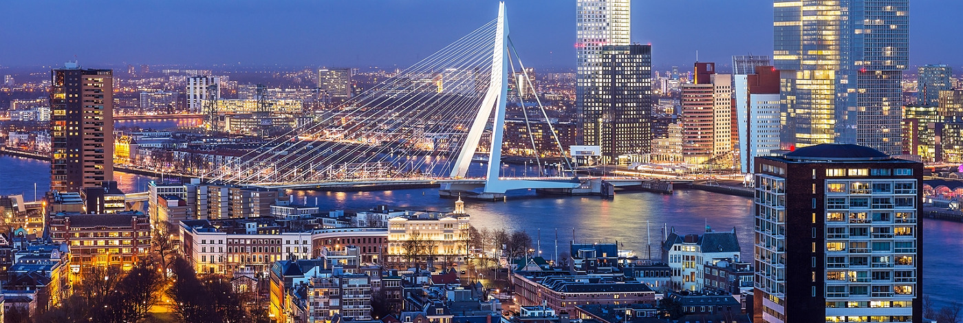 Aerial shot of Rotterdam skyline with Erasmus bridge at twilight as seen from the Euromast tower, The Netherlands
