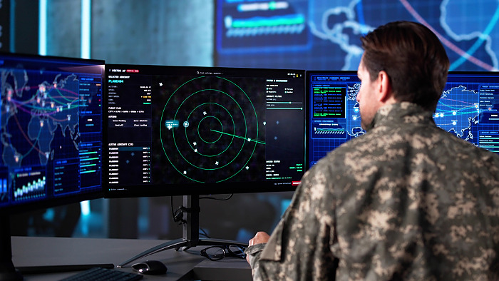 Senior Army Officer Analyzing Aerial Surveillance Data In Command Center