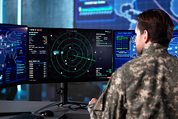 Senior Army Officer Analyzing Aerial Surveillance Data In Command Center