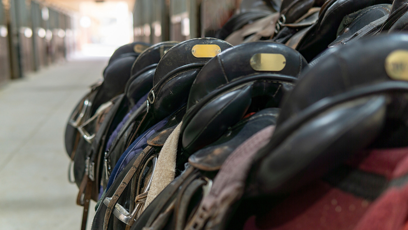 Horse saddles in the stable